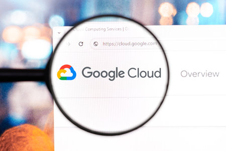 April 8, 2024, Brazil. In this photo illustration, the homepage of the Google Cloud Platform website seen on a computer screen through a magnifying glassのeditorial素材