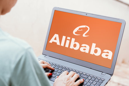 May 25, 2024, Brazil. In this photo illustration, the Alibaba Group logo is seen displayed on a laptop screenのeditorial素材
