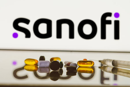 May 27, 2024, Brazil. In this photo illustration, the Sanofi logo is displayed on screen in the background with pills and medical bottle and syringeのeditorial素材