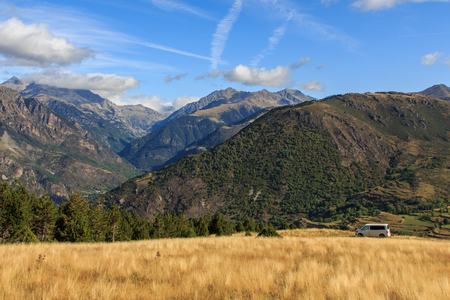 Durro, Spain; 09 25 2019: Volkswagen Caravelle T6 van parked on the mountain with cloudsのeditorial素材