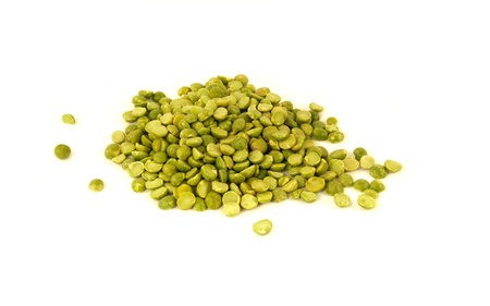 Organic green split peas isolated on a white backgroundの写真素材