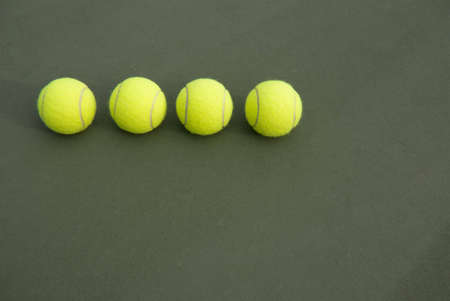 Four tennis ball on the courtの写真素材