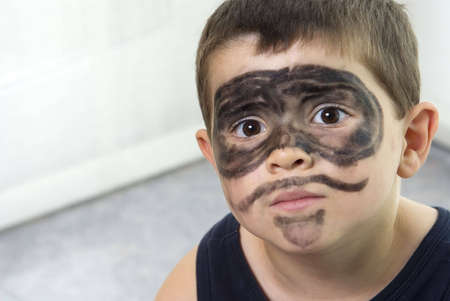 young happy boy in "The Zorro" make-upの写真素材