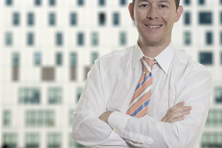 Business man arm crossed smilingの写真素材