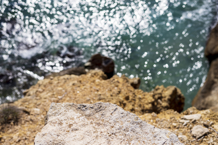 Wave breaking against cliff ,view from aboveの写真素材