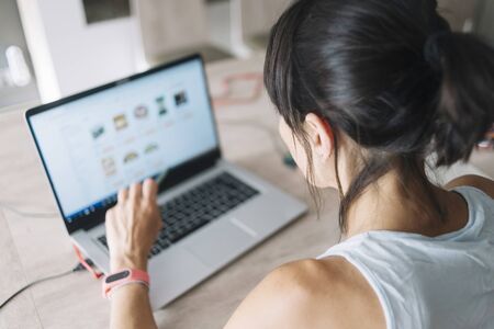 Woman with laptop working at homeの写真素材