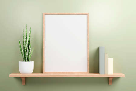 Small vertical wooden frame mockup in scandinavian style, green plant on ceramic pot and colored pastel books on a wooden shelf on green wall background. 3d renderingの写真素材