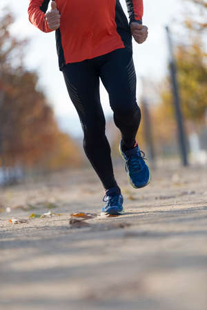 A Close-up of man running on pathwayの写真素材
