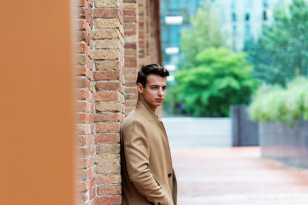 Young man wearing winter clothes in the street.の写真素材
