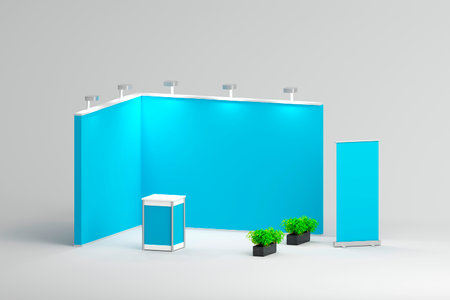A blue exhibition booth setup with a central podium and green plants on both sides, illuminated by spotlights. Ideal for eco-friendly brand displays.の写真素材