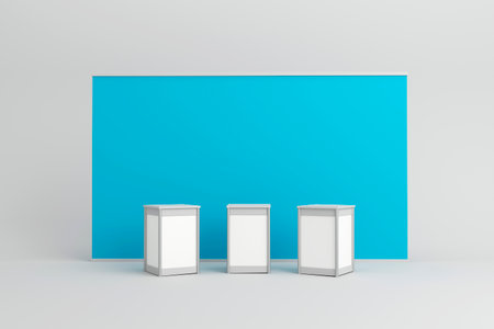 Three blank white display counters set against a large blue backdrop, ideal for branding and product presentations at trade shows, exhibitions, or events.の写真素材