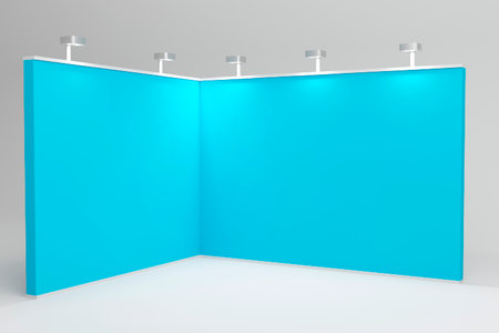 A sleek, blue exhibition booth featuring a three-wall setup with mounted spotlights. Ideal for trade shows, promoting products, or brand displays with focused lighting.の写真素材
