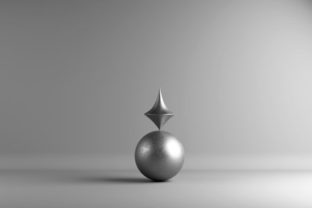 3D render of a silver sphere with a sharp, diamond-shaped metallic object balanced on top, set in a neutral gray studio. No people or background.の写真素材