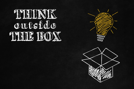 Concept design about freedom of mind and unconventional thinking outside the box, A blackboard with"think Outside the Box" concept, A slogan to motivate thinking differentlyの写真素材