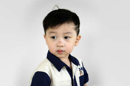 portrait of a little boy with modern hairstyle. Fashionable child in casual shirt.stylish little boy...