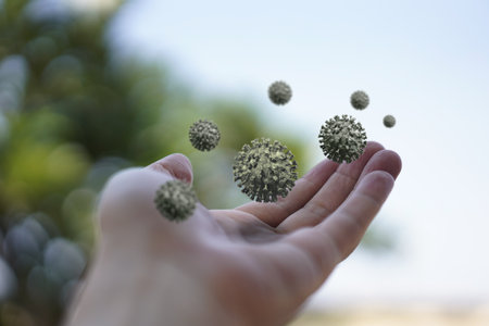 Human hand holding Coronavirus COVID-19 cells.の写真素材