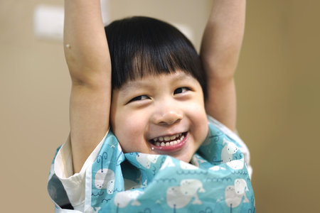 Japanese girl playing with her father (3 years old) (selective focus)の写真素材