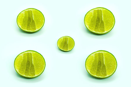 Slices of lime isolated on white background, top view.の写真素材