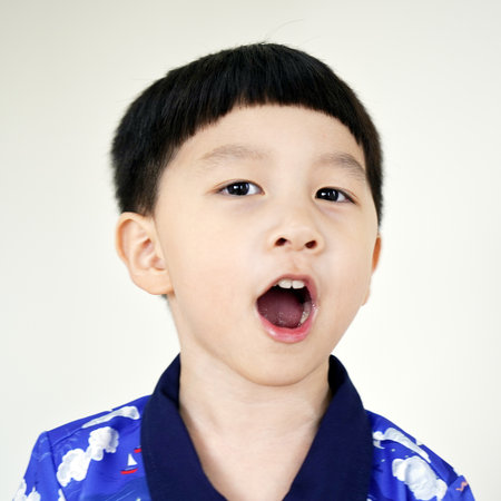 close-up portrait of child. funny little boy. Portrait Kid boy hair style. Portrait asian boy model. 3-5 years old.の写真素材