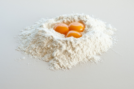 flour and eggs preparing a cake の写真素材