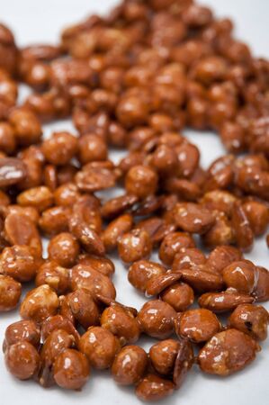 caramelised hazelnuts on a white marble 