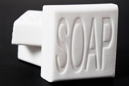 Soap bars on black background 