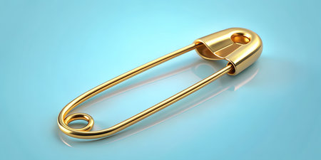 Elegant golden safety pin gleaming on serene blue background, bringing concepts of safety and securityの写真素材