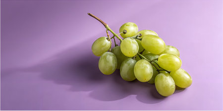 Fresh green grapes on a vibrant purple background offer a refreshing, healthy treat, perfect for...