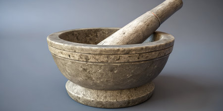 Rustic stone mortar and pestle set. Ancient kitchen tool. Weathered texture of grinding bowl....