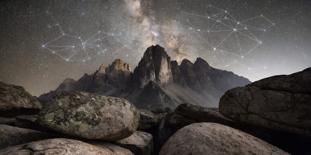 Breathtaking astronomical landscape showing starry night sky above rocky alpine terrain. prominent...