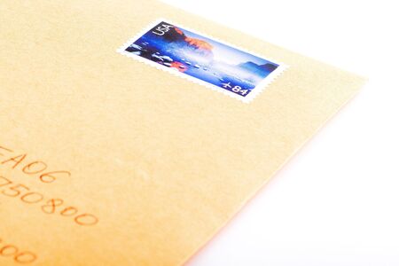 Shoot of letter with stamp on a white background.