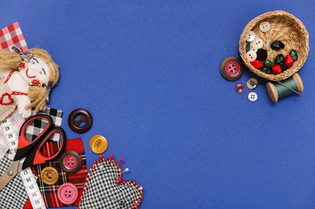 The picture of objects related to sewing on blue textile.の写真素材