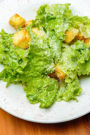 Green salad with croutons, cheese and chickenの写真素材
