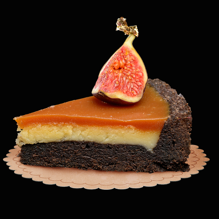 Cut of bright dessert isolated on blackの写真素材