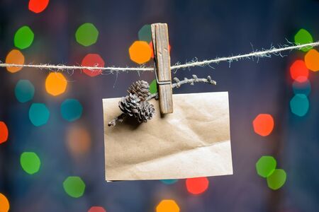 New Years greeting card hanging on rope with pin