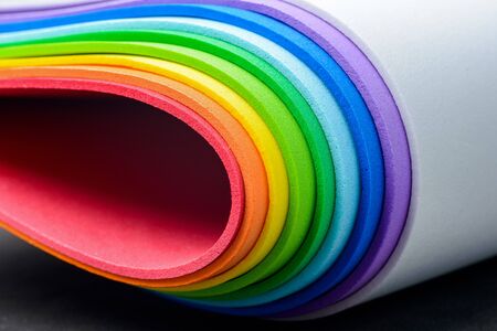 Thin sheets of multicolored cellular rubber arranged into iridescent shapeの写真素材