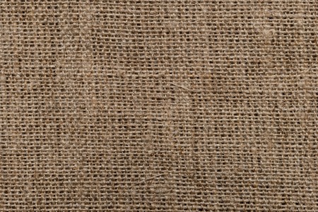 Natural coarse canvas textile background usable as wallpaper