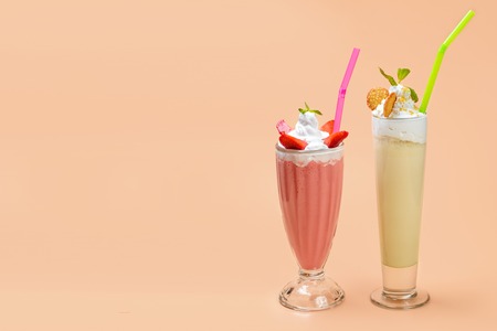 Fruit Milkshake in high glass with tubeの写真素材