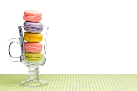 Colorful macarons in clear glass isolated on whiteの写真素材