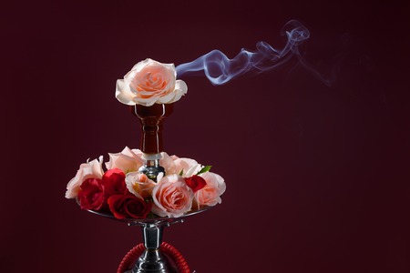 Asian hookah decorated with flowers on dark backgroundの写真素材