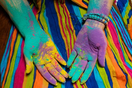 Colorful holi painted hands in different positionsの写真素材