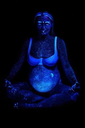 Pregnant girl in neon lightの写真素材