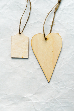 Handmade wooden heart on light background as greeting cardの写真素材