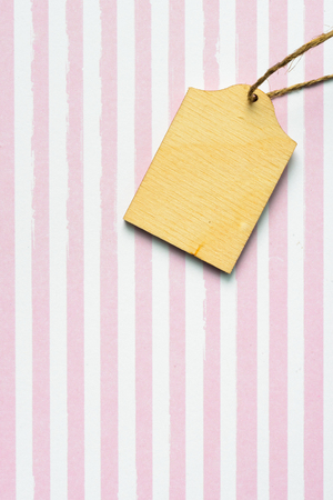 Handmade wooden label on textile background as greeting cardの写真素材