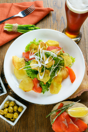 Salty salad with beerの写真素材