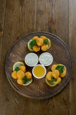 Cheese balls with honey sauceの写真素材