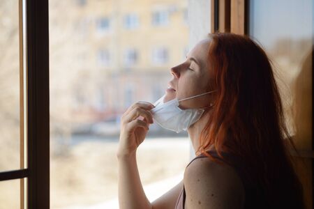 Redhead woman at quarantine