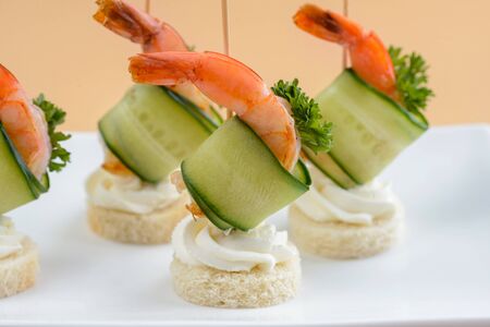 Canape with cucumber and shrimpの写真素材