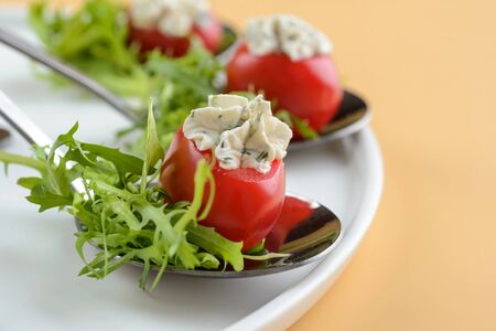 Stuffed tomatoes with arugulaの写真素材