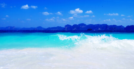 Clear blue ocean with mountain background